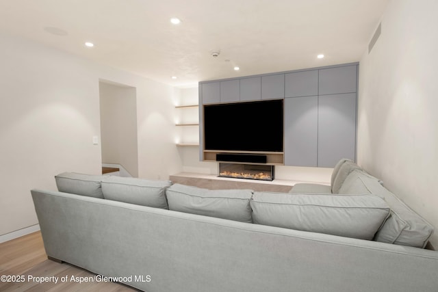 211 W Main St, Aspen, CO 81611 - living area featuring light wood finished floors and recessed lighting