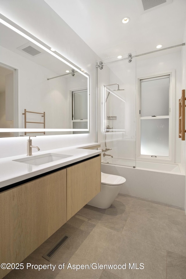211 W Main St, Aspen, CO 81611 - full bath featuring bathing tub / shower combination, toilet, vanity, and recessed lighting
