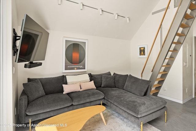 211 W Main St, Aspen, CO 81611 - living room featuring track lighting, stairway, and vaulted ceiling