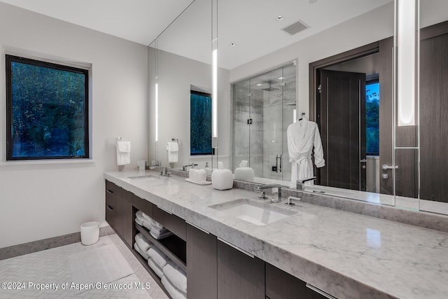 bathroom with vanity and an enclosed shower