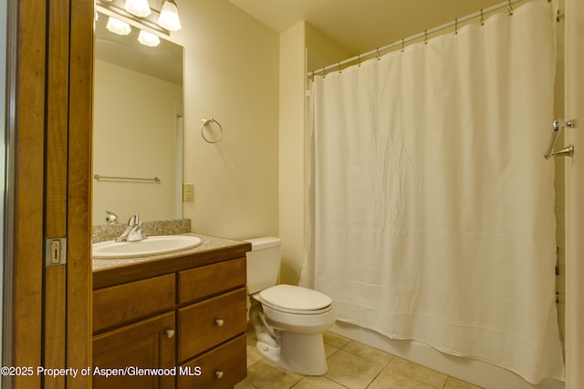 201 14th St Unit 300, Glenwood Springs, CO 81601 - bathroom featuring toilet, tile patterned flooring, vanity, and shower / bath combo