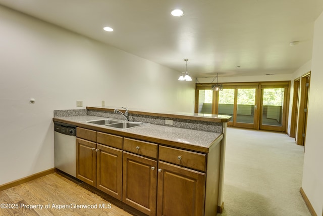 201 14th St Unit 300, Glenwood Springs, CO 81601 - kitchen with dishwasher, a sink, a peninsula, brown cabinetry, and recessed lighting