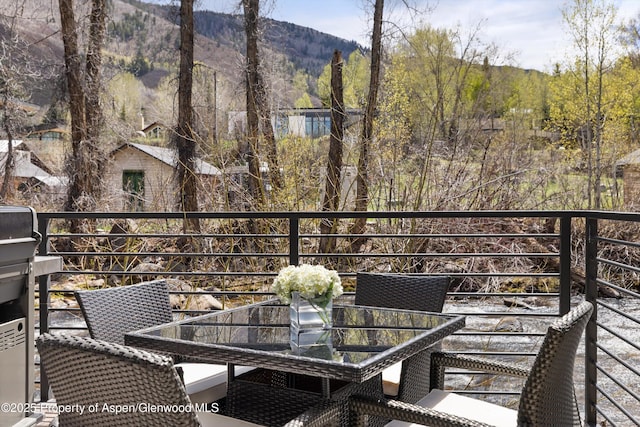 1039 E Cooper Ave Unit 21, Aspen, CO 81611 - balcony featuring outdoor dining space and a mountain view