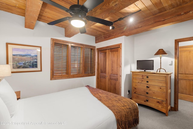 1039 E Cooper Ave Unit 21, Aspen, CO 81611 - bedroom with carpet floors, wood ceiling with exposed beams, a closet, and a ceiling fan