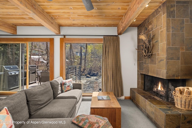 1039 E Cooper Ave Unit 21, Aspen, CO 81611 - living room featuring wooden ceiling with exposed beams, carpet, a fireplace, and baseboards