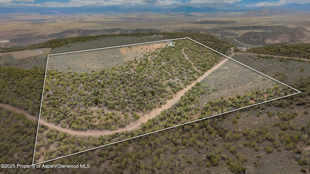 2051 Grass Mesa Rd, Rifle, CO 81650 - overview of rural landscape featuring property boundaries highlighted, a mountain backdrop, and a desert landscape