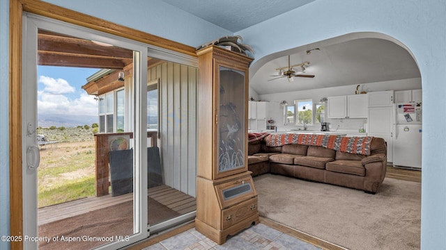 2051 Grass Mesa Rd, Rifle, CO 81650 - living area with a ceiling fan, lofted ceiling, and arched walkways