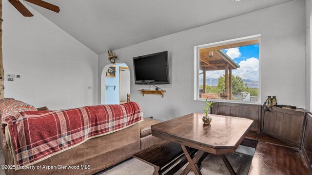2051 Grass Mesa Rd, Rifle, CO 81650 - living room with lofted ceiling, a ceiling fan, arched walkways, and dark wood-type flooring
