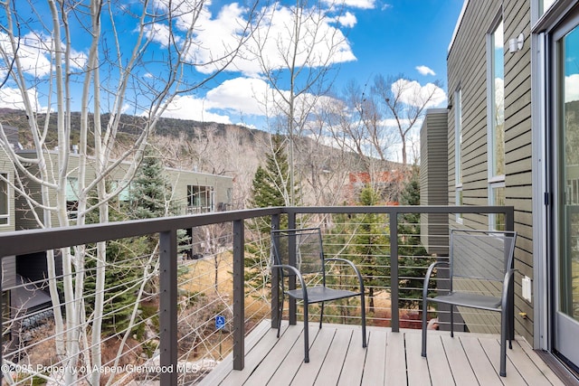 balcony featuring a mountain view