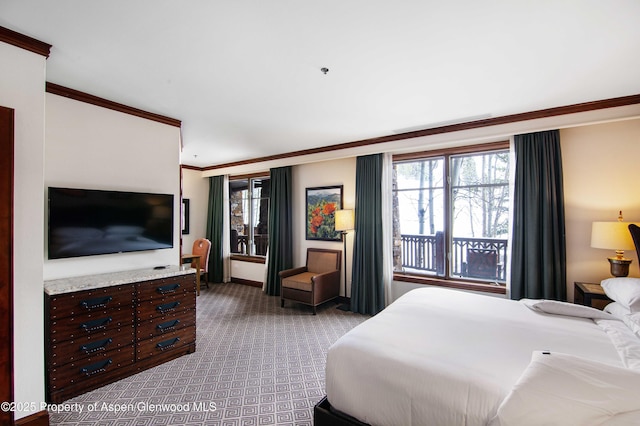 carpeted bedroom featuring ornamental molding