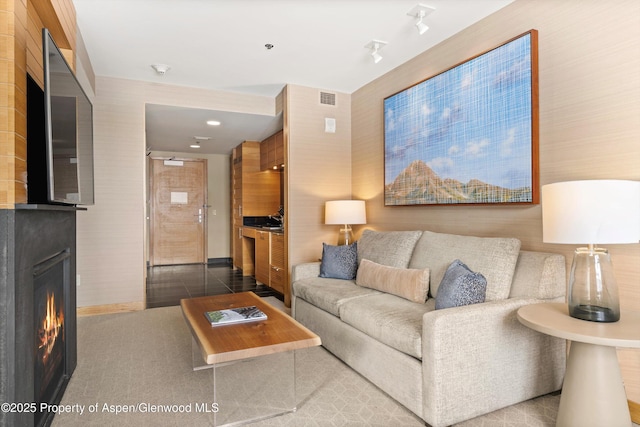 living room with tile patterned floors