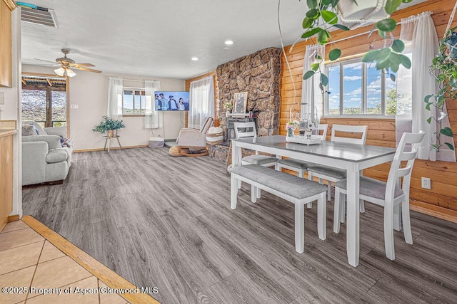 5904 County Road 31, Craig, CO 81625 - dining room with wood finished floors, a ceiling fan, baseboards, recessed lighting, and wood walls