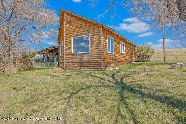 5904 County Road 31, Craig, CO 81625 - view of side of property featuring a lawn