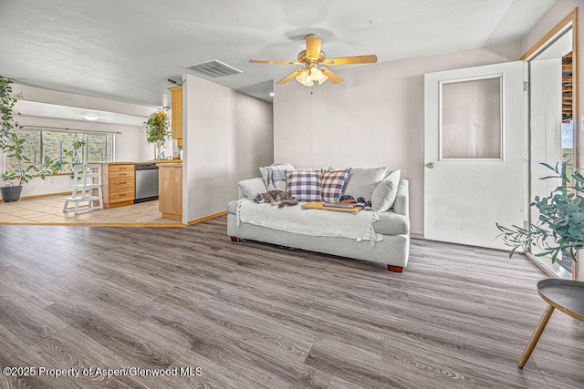 5904 County Road 31, Craig, CO 81625 - living room featuring light wood-style floors, a ceiling fan, and baseboards
