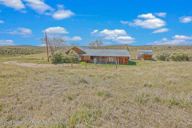 5904 County Road 31, Craig, CO 81625 - view of yard featuring a view of countryside, fence, and an outdoor structure