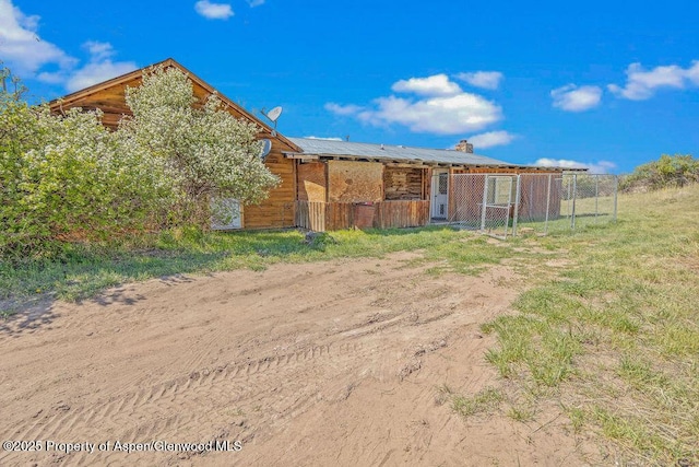 5904 County Road 31, Craig, CO 81625 - rear view of house with a chimney