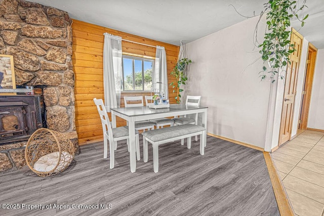 5904 County Road 31, Craig, CO 81625 - dining room featuring wood finished floors, a wood stove, and baseboards