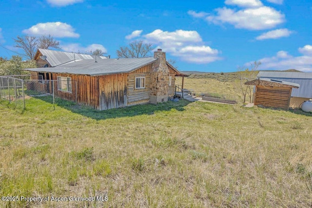 5904 County Road 31, Craig, CO 81625 - rear view of property featuring a chimney
