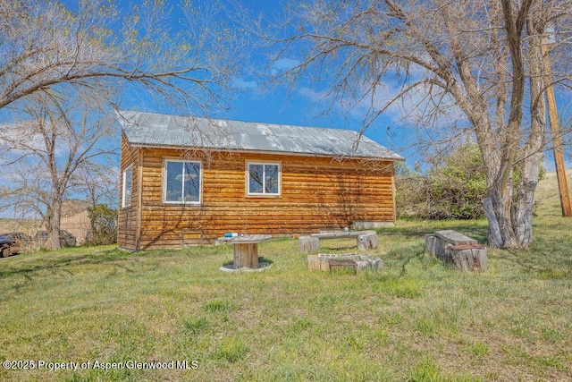 5904 County Road 31, Craig, CO 81625 - view of home's exterior featuring a yard and metal roof
