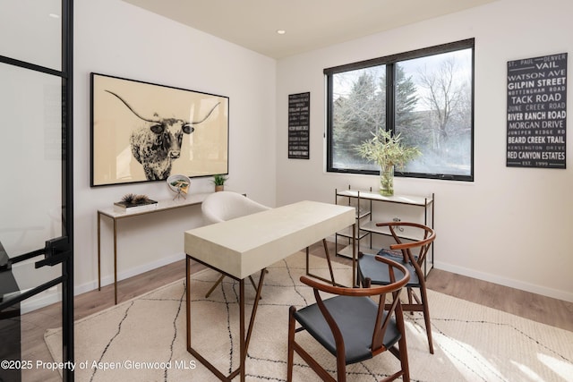 office featuring recessed lighting, light wood-type flooring, and baseboards