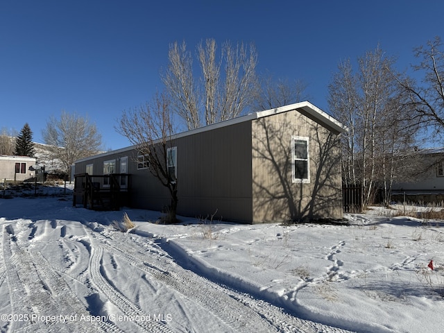 view of snow covered property