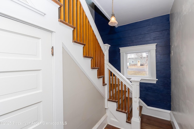 stairs featuring wood-type flooring