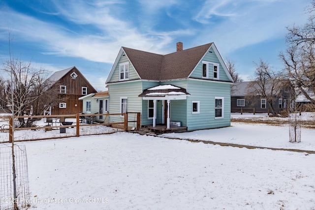 view of snow covered house