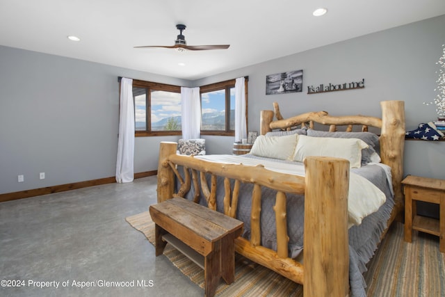 bedroom featuring ceiling fan and concrete floors