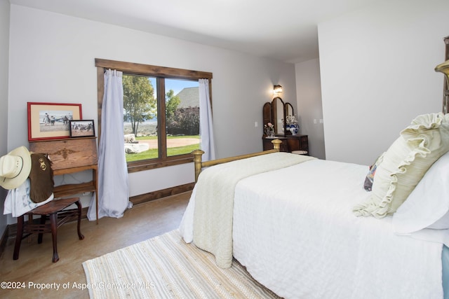 bedroom with light colored carpet