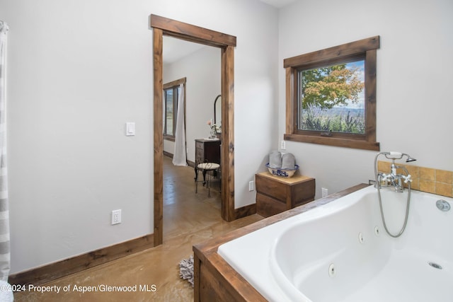 bathroom with tiled tub