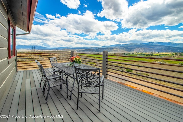 wooden terrace with a mountain view