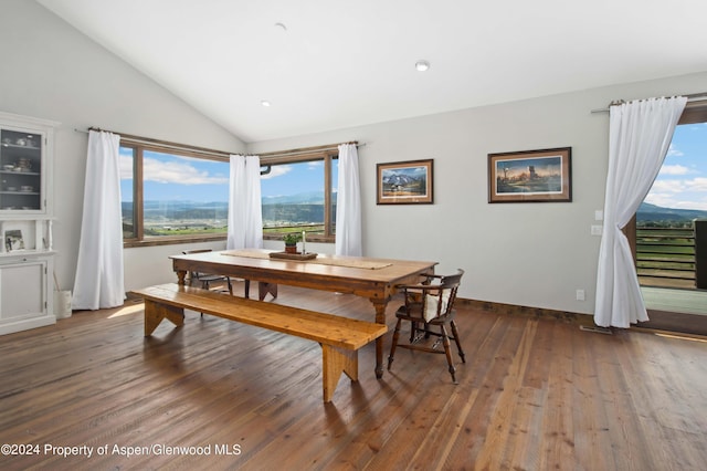 dining space featuring lofted ceiling, a mountain view, and dark hardwood / wood-style floors