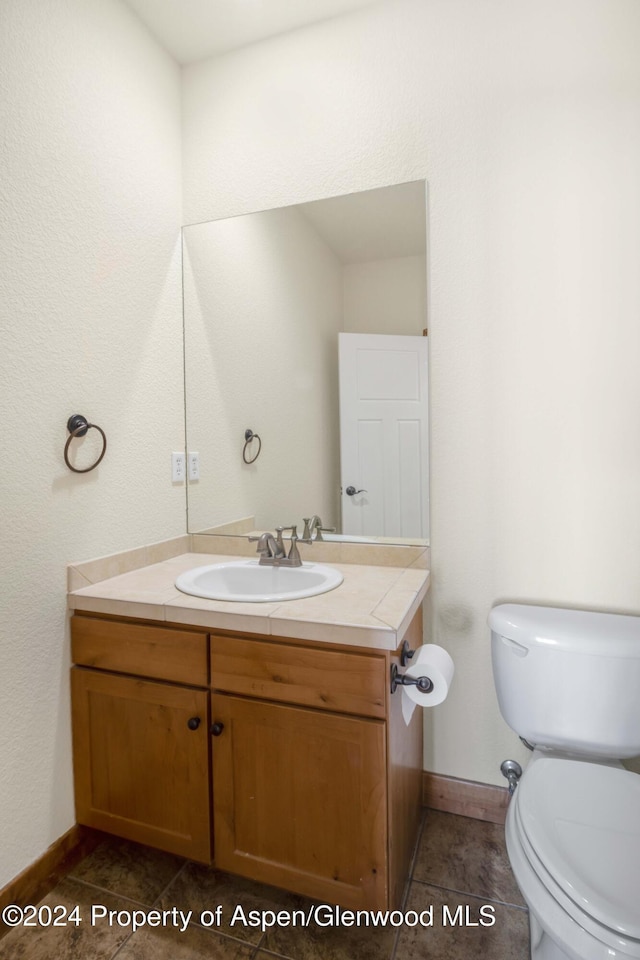 bathroom with vanity and toilet