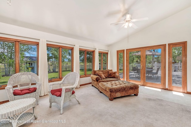 sunroom with ceiling fan and vaulted ceiling