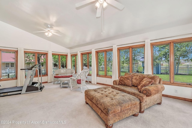 sunroom / solarium with ceiling fan and lofted ceiling