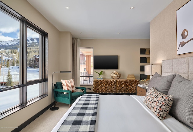 carpeted bedroom with a mountain view