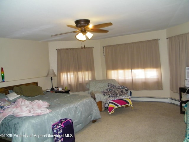 1558 E 12th St, Rifle, CO 81650 - bedroom featuring carpet flooring, a baseboard heating unit, and a ceiling fan