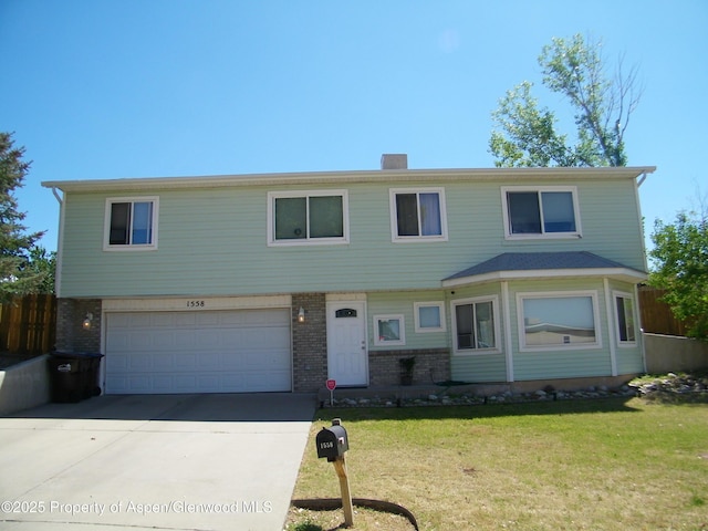 1558 E 12th St, Rifle, CO 81650 - view of front of property with brick siding, concrete driveway, a garage, and a chimney