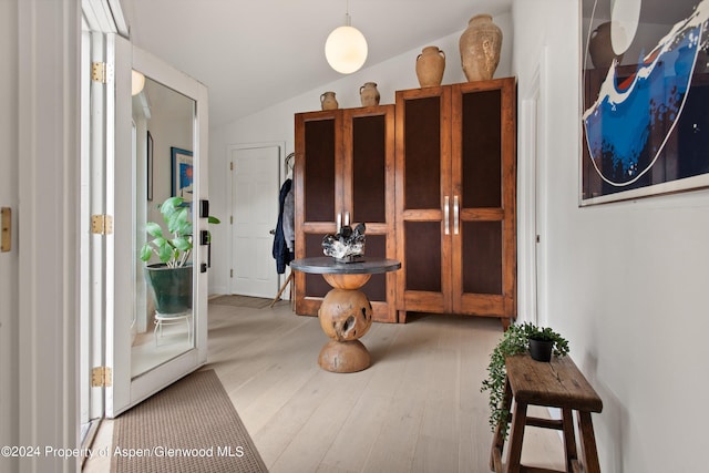 interior space with lofted ceiling and wood finished floors