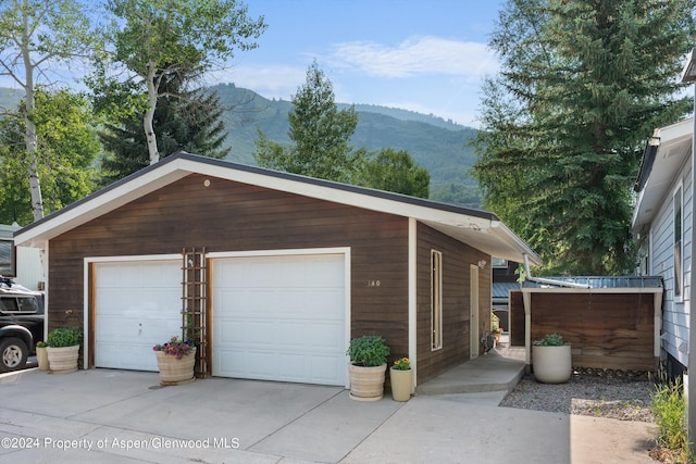 detached garage featuring a mountain view