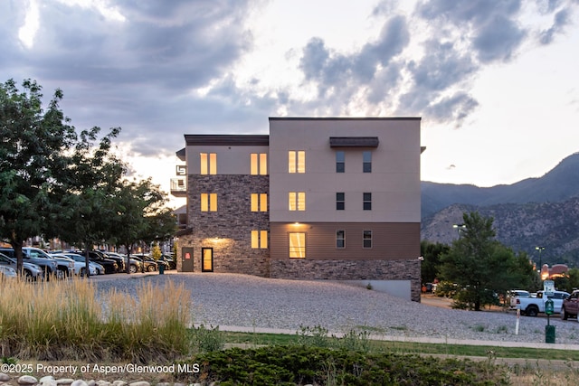 253 Wulfsohn Rd Unit 312, Glenwood Springs, CO 81601 - view of property with uncovered parking and a mountain view