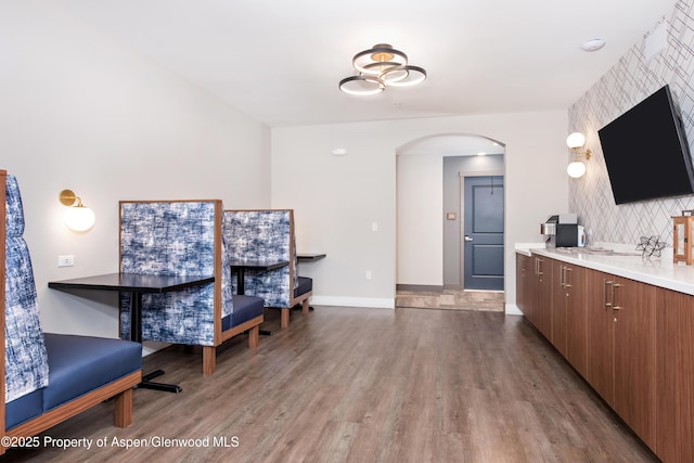 253 Wulfsohn Rd Unit 312, Glenwood Springs, CO 81601 - office area with arched walkways, wood finished floors, and baseboards