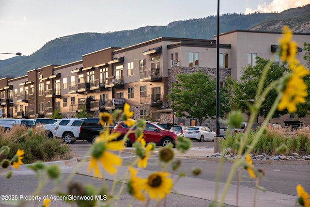 253 Wulfsohn Rd Unit 312, Glenwood Springs, CO 81601 - view of property featuring a mountain view and uncovered parking
