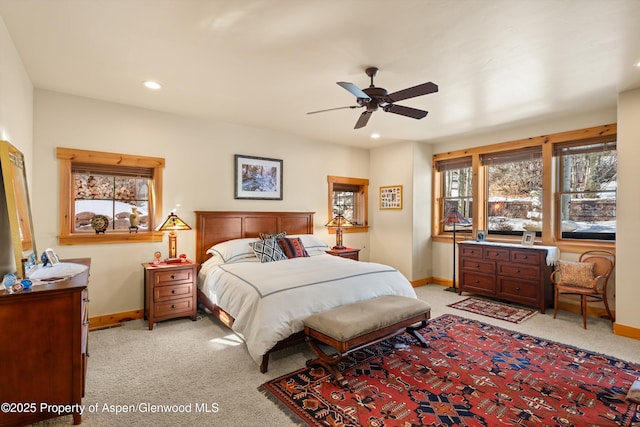 bedroom with recessed lighting, light colored carpet, ceiling fan, and baseboards