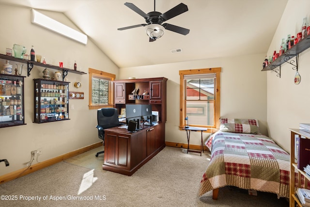 bedroom with baseboards, visible vents, light colored carpet, lofted ceiling, and ceiling fan