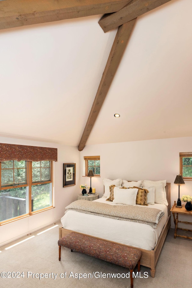 bedroom featuring carpet and lofted ceiling with beams