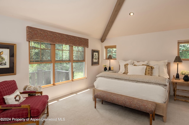 bedroom featuring carpet floors and lofted ceiling with beams