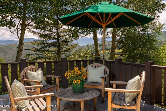 wooden deck featuring a mountain view