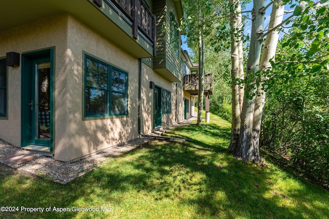 view of home's exterior with a yard