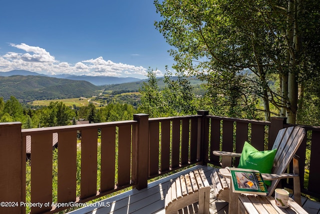 wooden terrace with a mountain view